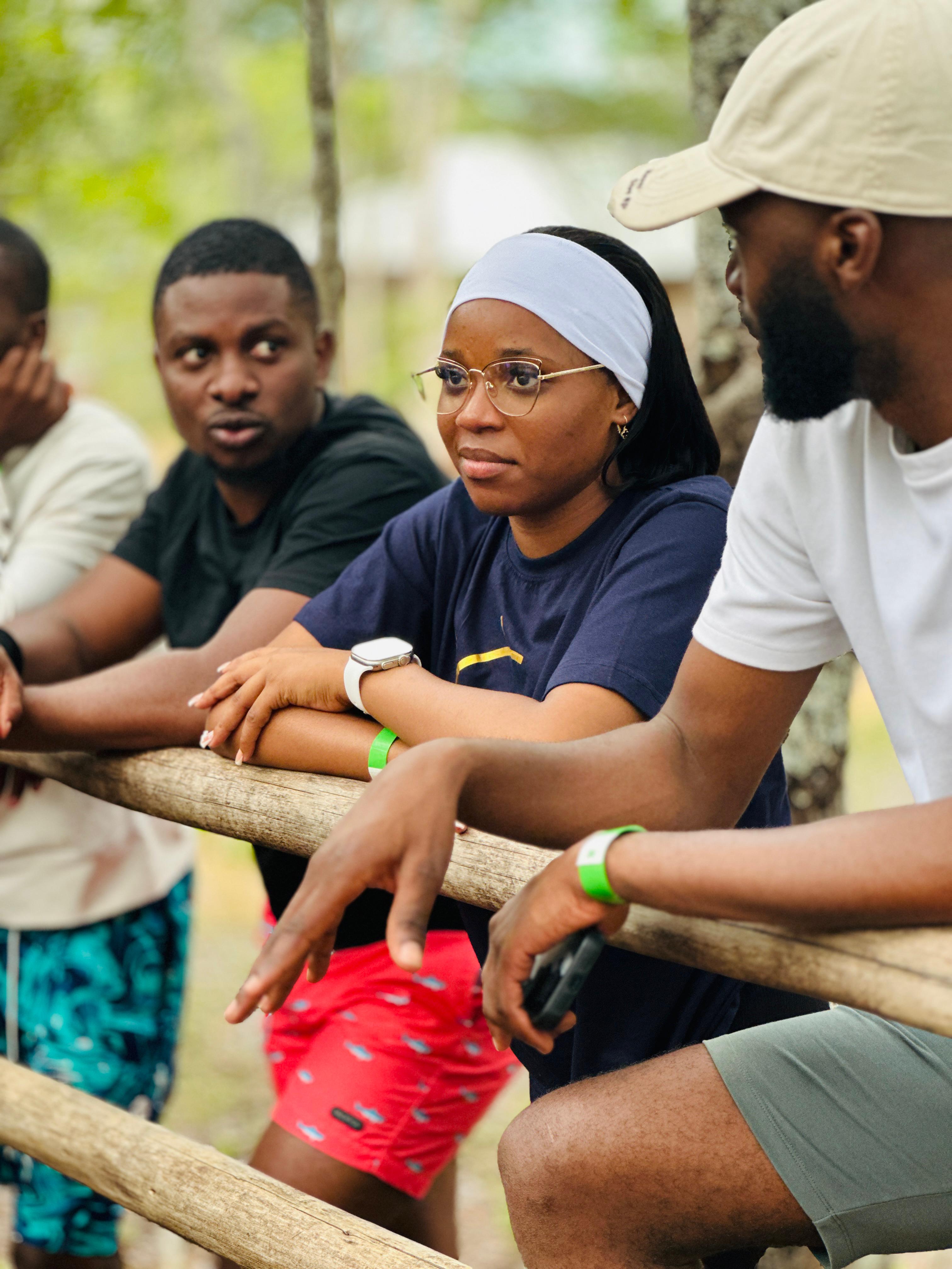 Young adults gathered together for a focused camp conversation