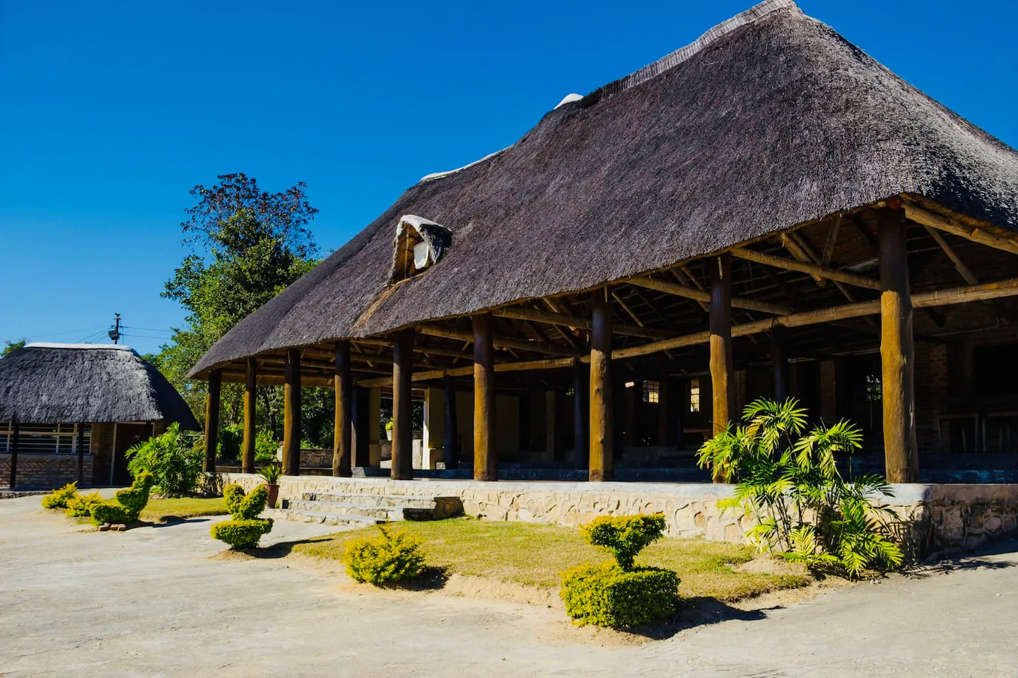 Open-sided main pavilion with a large thatched roof at Karumazondo Resort